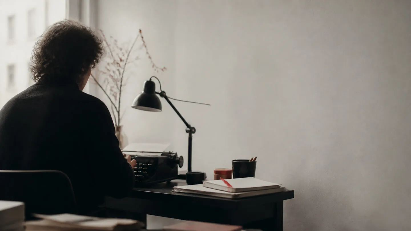 Author workspace with manuscripts and typewriter
